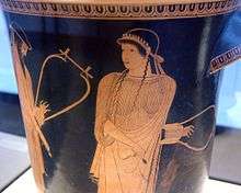 Red-figure vase painting of a woman holding a lyre.  On the left, a bearded man with a lyre is partially visible.