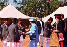 With HM Queen Elizabeth II.