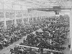alt=Machining operations inside a large building