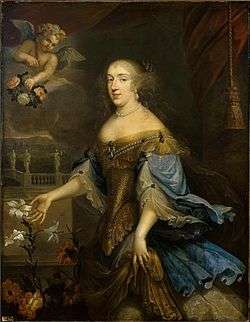 A portly blond-haired lady in a Baroque décolleté embraces an Easter lily.